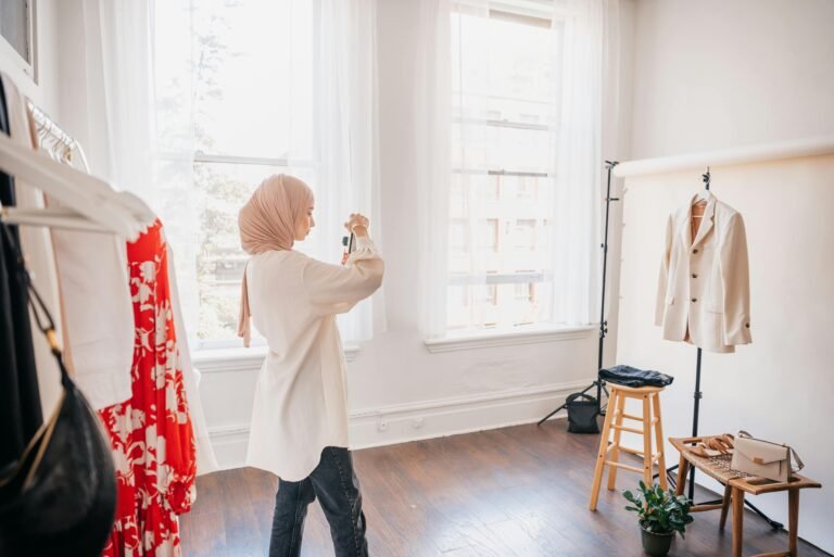 Image of a woman taking a photo of her products for her e-commerce business in the UAE